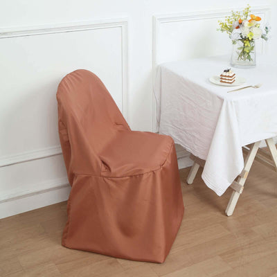 Brown chair cover draped over a chair at a table with dessert.