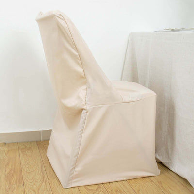 Beige padded chair with a sleek design against a plain backdrop