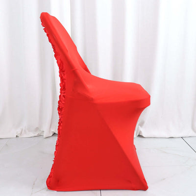 Red chair cover with floral detailing on a plain backdrop.