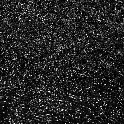 Black textured surface with a glossy finish.