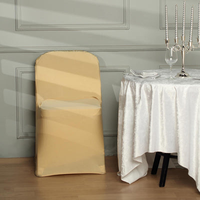 Yellow chair cover draped over a chair beside an elegantly set table.