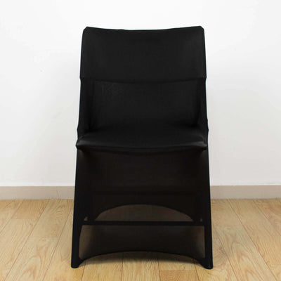 Black modern chair with a sleek design on a wooden floor.