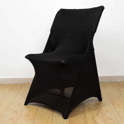 Black folding chair with a modern design on a wooden floor.