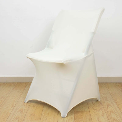 White modern chair on a wood floor.