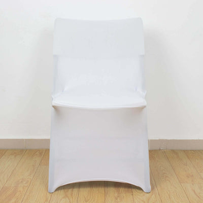 Transparent plastic chair on a plain backdrop