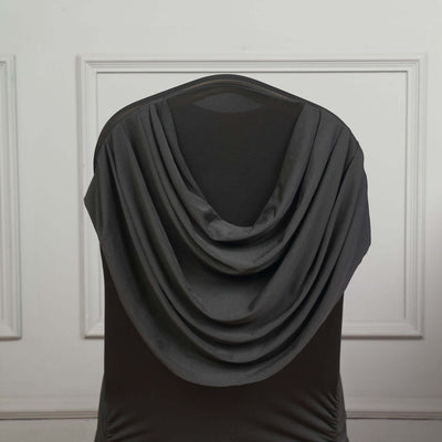 Draped gray fabric on a chair, showcasing elegant folds and texture.