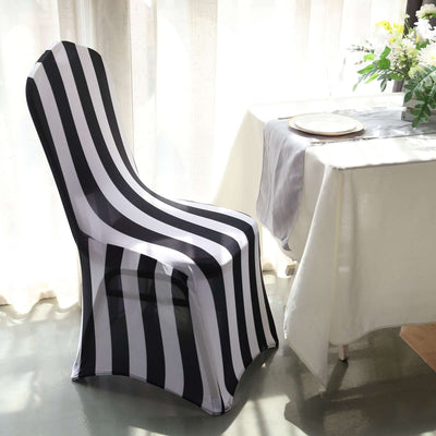 Black and white striped chair cover in a bright dining setting.