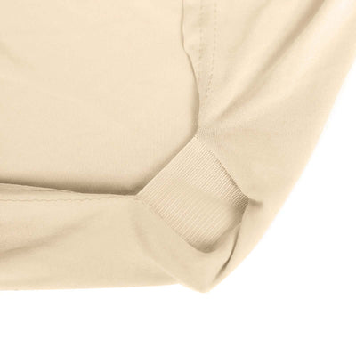 Beige fabric close-up showcasing soft texture and stitching details.