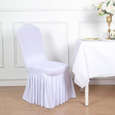 White chair cover draped on a chair at a table setting.