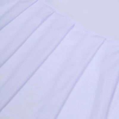 White pleated fabric texture on a soft surface.