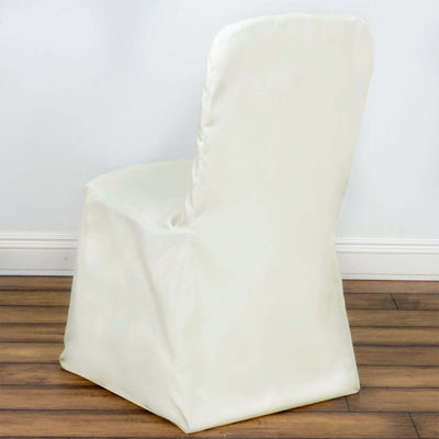 White slipcovered chair viewed from the back, showcasing its smooth design.