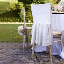 Chiavari chair slip covers - White Tulle and Spandex Chair Cover sitting next to a table