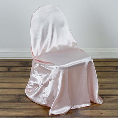 Pink satin chair cover draped elegantly over a chair