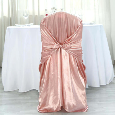 Rose gold satin chair cover with a decorative knot.