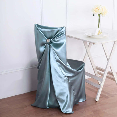 Elegant teal satin chair cover with decorative knot detail.