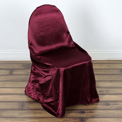 Burgundy satin chair cover draped elegantly over a chair.