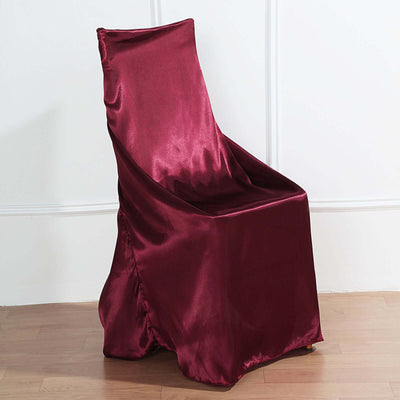 Burgundy chair cover draped over a chair, showcasing elegant fabric design.