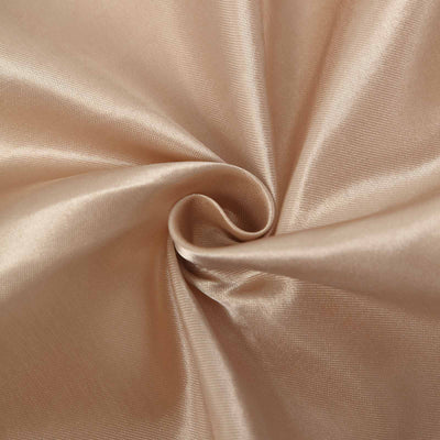 Beige satin fabric swirled in a close-up texture shot.