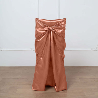 Copper satin chair cover with bow detail, elegant event decor.