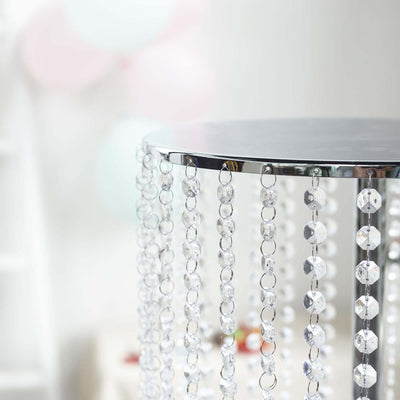 Crystal beaded table with a sleek chrome finish.