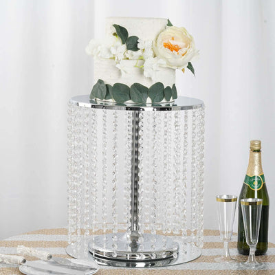 Elegant cake stand with crystal accents and floral decoration.