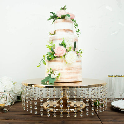Elegant three-tier wedding cake adorned with flowers on a decorative cake stand.