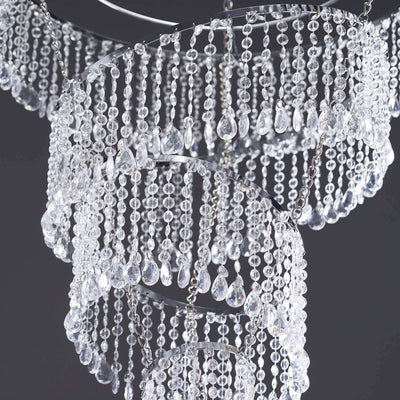 Elegant crystal chandelier with cascading beads and a modern design.