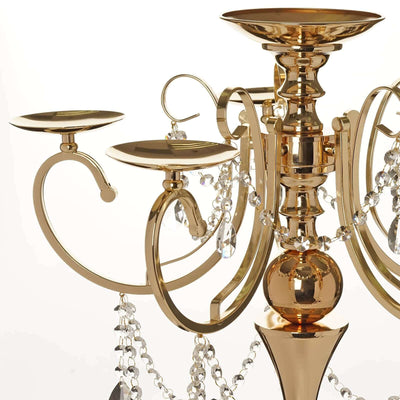 Gold chandelier with crystal accents and candle holders