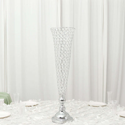 Elegant crystal vase centerpiece on a decorated table.