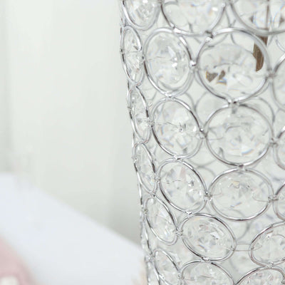 Crystal decorative vase with intricate wire design.