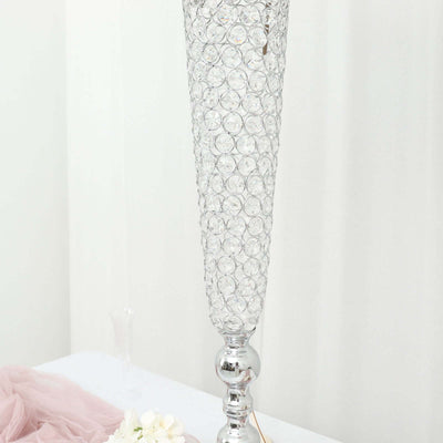 Elegant crystal lamp with a sleek silver base, perfect for home decor.