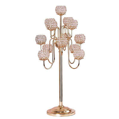 Elegant gold candle holder with crystal accents, featuring nine candle cups.