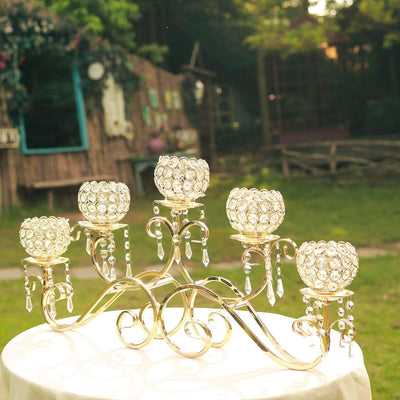 Elegant crystal candle holder with five arms and decorative accents.