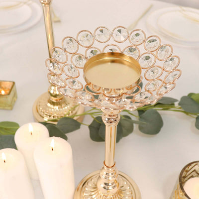 Gold candlestick holder with crystal accents and a round tray.