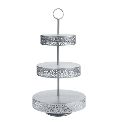 Three-tiered silver serving stand with decorative cutouts. #whtbkgd