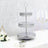 Three-tiered decorative metal serving stand with intricate cutouts.