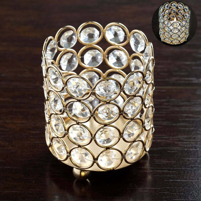 Gold crystal candle holder with circular gem design.