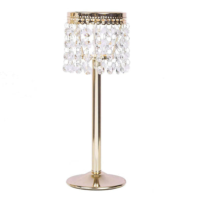 Gold table lamp with crystal accents on a white background.
