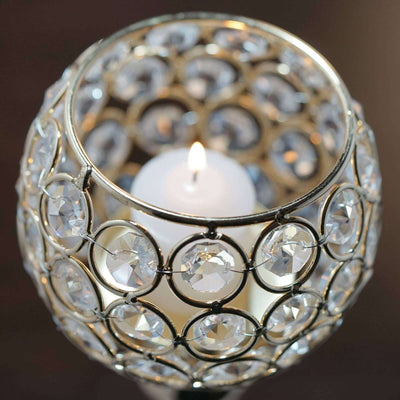 Elegant crystal candle holder with a white candle inside.