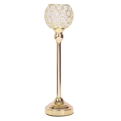 Gold decorative table lamp with crystal detailing, studio shot.