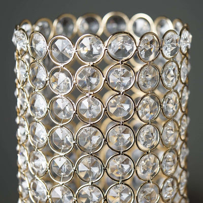 Elegant crystal candle holder with intricate gold detailing.
