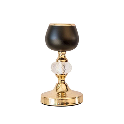 Elegant black and gold candle holder with crystal accent