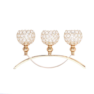 Gold candle holder with three crystal cups