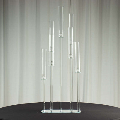 Clear glass vase display with multiple tubes in varying heights.