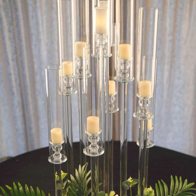 Elegant glass candle holder centerpiece with multiple candles.