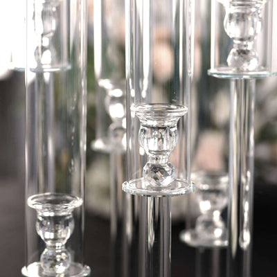 Elegant glass candle holders in various heights for stylish decor.