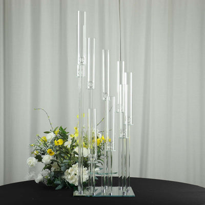 Elegant glass flower vase display with multiple tubes and floral arrangement.