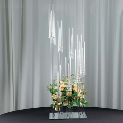 Elegant candle holder with floral arrangement, featuring multiple glass tubes and candles.