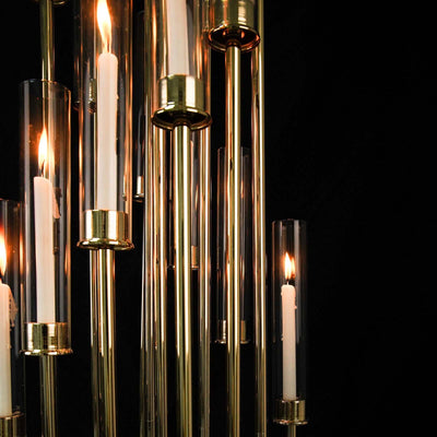 Elegant chandelier with candle-style lights in clear glass tubes.