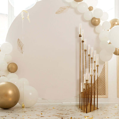 Decorative candle holder with gold accents in a festive setting.